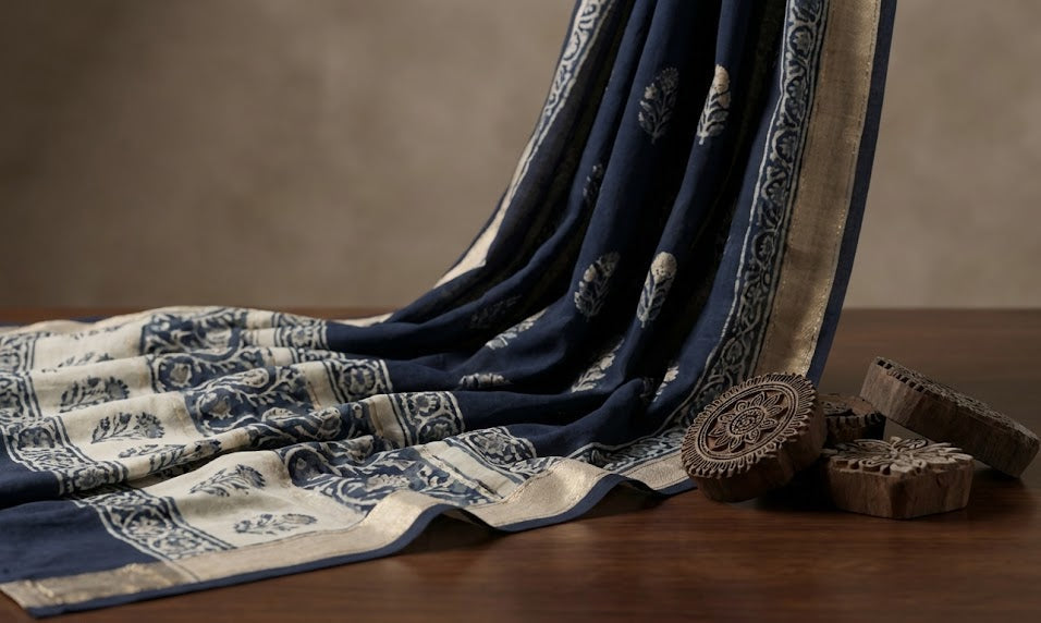 Decorative fabric with intricate patterns on a wooden surface